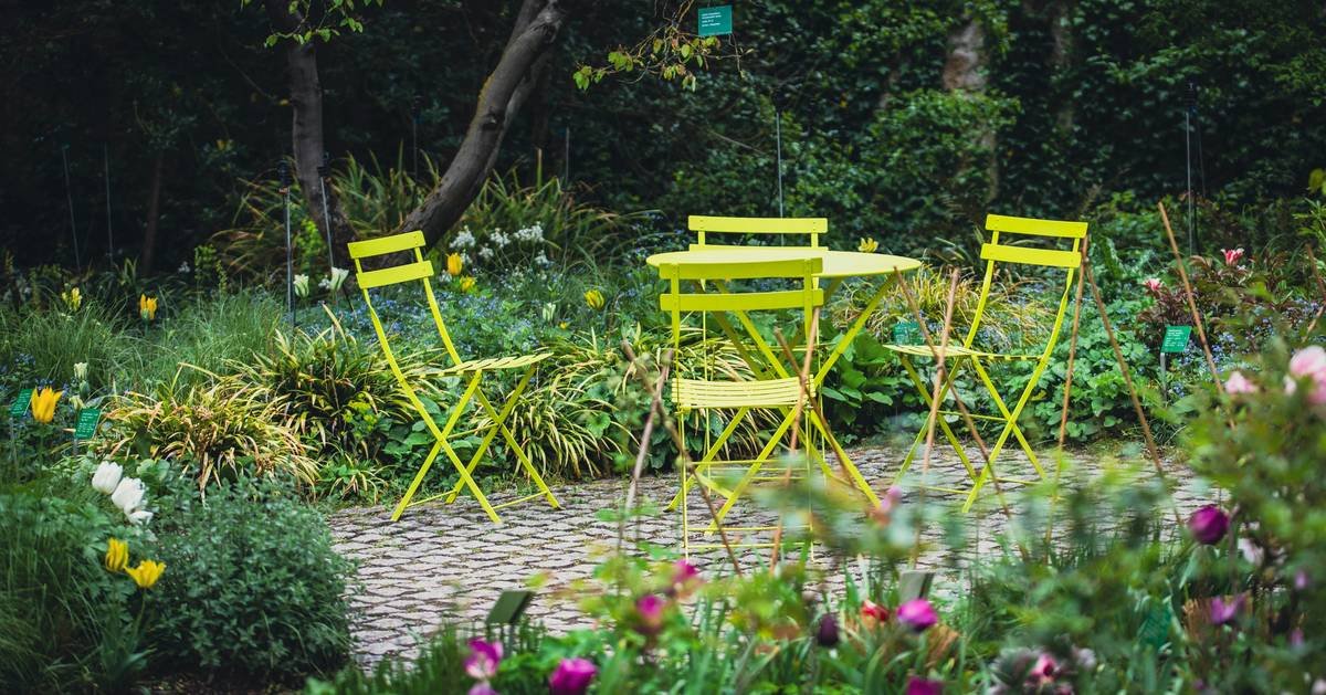 Stacked wooden garden benches clearance sale at local nursery