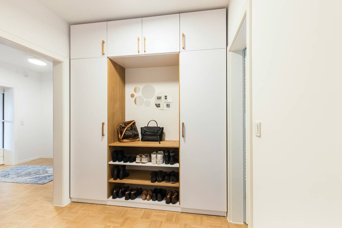 close-up of entryway benches with shoe storage showing internal compartment design