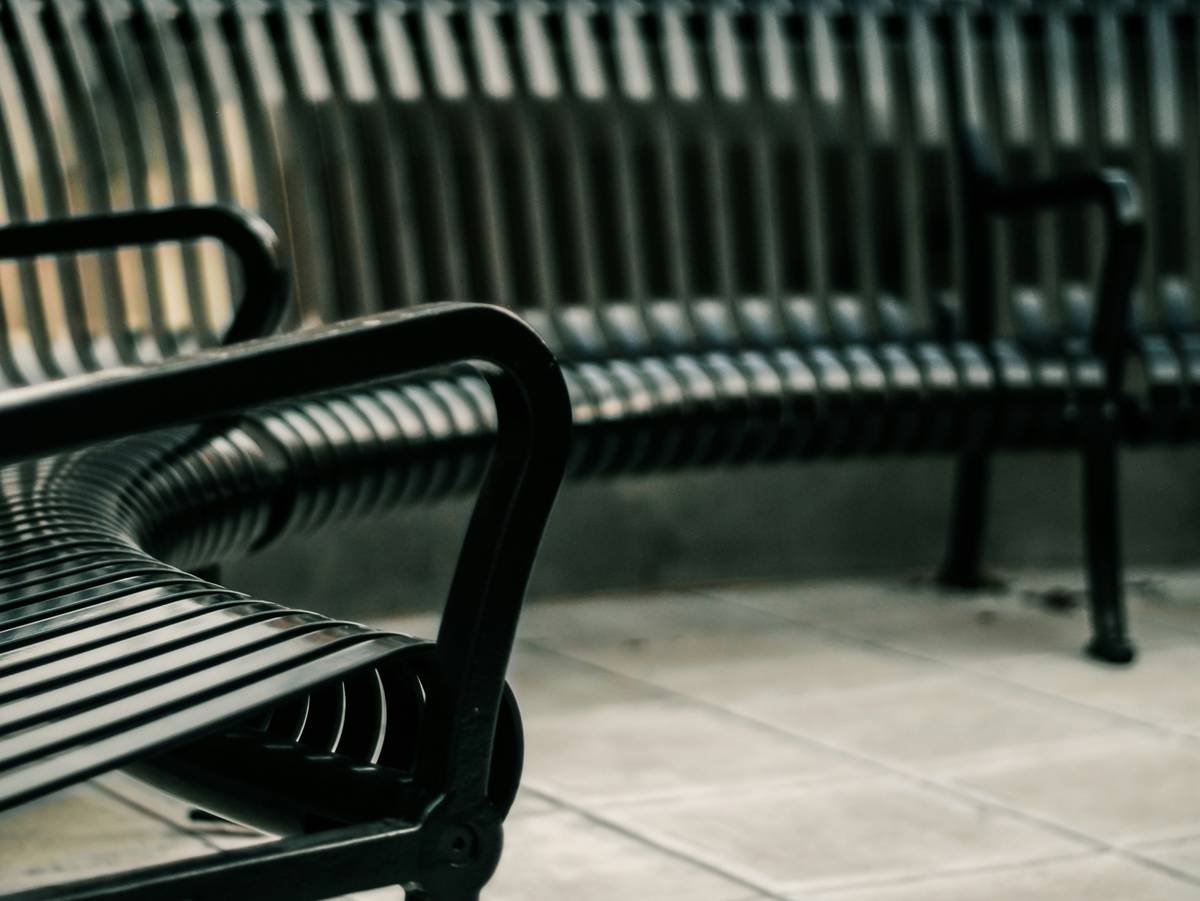 Side-by-side comparison of failed vs. durable outdoor benches commercial in urban setting